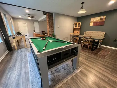 a living room with a pool table in it at **Stylish Pet Friendly 3 Bedroom House** in Cleveland