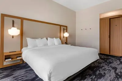 a large white bed in a hotel room at Fairfield by Marriott Inn & Suites Sandusky in Sandusky