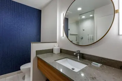 a bathroom with a sink and a mirror at Fairfield by Marriott Inn & Suites Sandusky in Sandusky