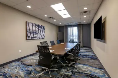 a conference room with a long table and chairs at Fairfield by Marriott Inn & Suites Sandusky in Sandusky