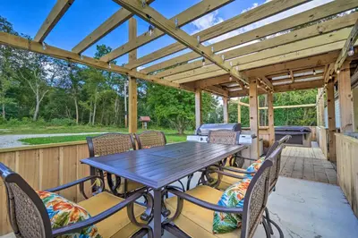 a wooden deck with a wooden table and chairs at Take 5 Retreat with Hot Tub Relax, Rest, Refresh! in Somerset