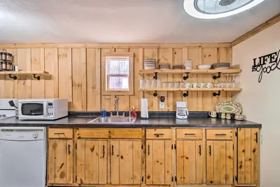 a kitchen with wooden cabinets and a sink and a microwave at Take 5 Retreat with Hot Tub Relax, Rest, Refresh! in Somerset