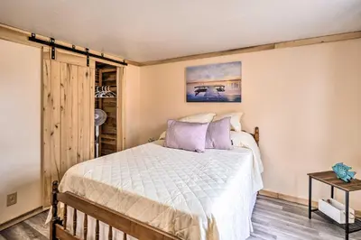 a bedroom with a large bed in a room at Take 5 Retreat with Hot Tub Relax, Rest, Refresh! in Somerset