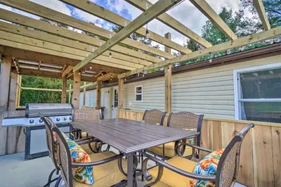 a patio with a table and chairs and a grill at Take 5 Retreat with Hot Tub Relax, Rest, Refresh! in Somerset