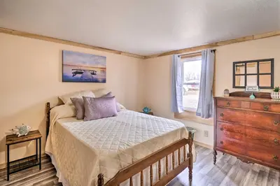 a bedroom with a bed and a dresser and a window at Take 5 Retreat with Hot Tub Relax, Rest, Refresh! in Somerset