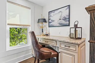 a home office with a desk and a chair at Gather Together - Charming Home for 20 Near Ark! in Williamstown