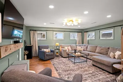 a large living room with a couch and chairs at Gather Together - Charming Home for 20 Near Ark! in Williamstown