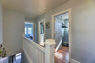 a home with a staircase and aoyer with a stair case at Pet-Friendly Covington Retreat with Fenced Yard in Covington