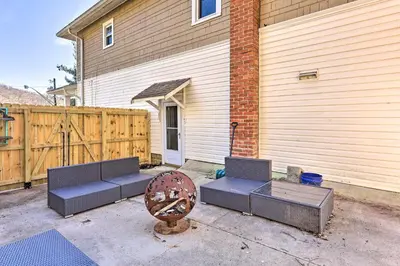 a patio with two couches in front of a house at Pet-Friendly Covington Retreat with Fenced Yard in Covington