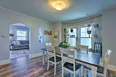 a dining room and living room with a table and chairs at Pet-Friendly Covington Retreat with Fenced Yard in Covington