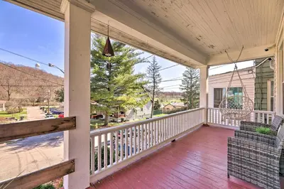 a porch of a home with a white railing at Pet-Friendly Covington Retreat with Fenced Yard in Covington