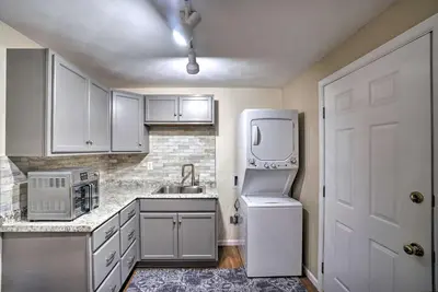 a kitchen with white appliances and a white refrigerator at Delightful Tipp City Unit with Covered Patio! in Tipp City