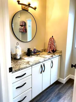 a bathroom with a white sink and a mirror at Harborview 3-6-8 on Main in Huron