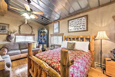 a bedroom with a bed and a couch at Renovated Bunkhouse on 12-Acre Horse Farm! in Perrysville