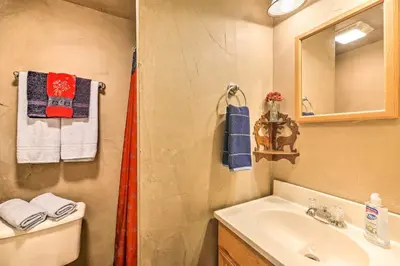 a bathroom with a sink and a mirror at Renovated Bunkhouse on 12-Acre Horse Farm! in Perrysville