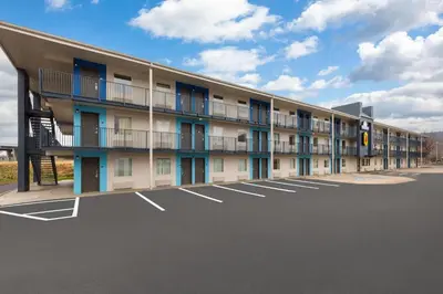 an empty parking lot in front of a building at Super 8 by Wyndham Charleston WV in Charleston