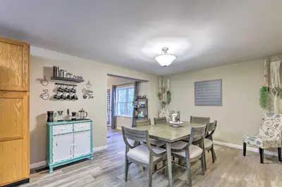 a dining room with a table and chairs at Single-Story Home in Fairborn with Yard and Patio! in Fairborn