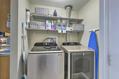 a small kitchen with a sink and a dishwasher at Single-Story Home in Fairborn with Yard and Patio! in Fairborn