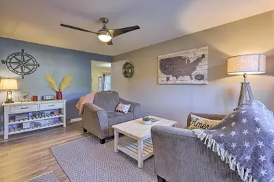 a living room with a couch and a table at Single-Story Home in Fairborn with Yard and Patio! in Fairborn