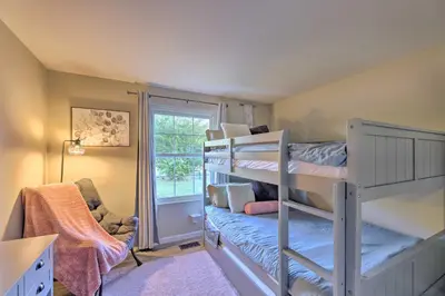 a room with two bunk beds and a window at Single-Story Home in Fairborn with Yard and Patio! in Fairborn