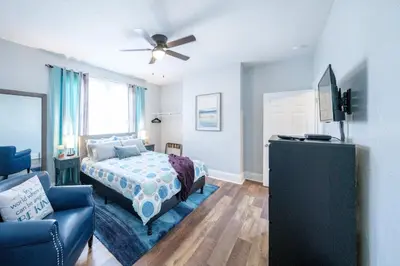 a bedroom with a bed and a ceiling fan at Robin's Nest - Miami U, Weddings or Spooky Nook! in Hamilton