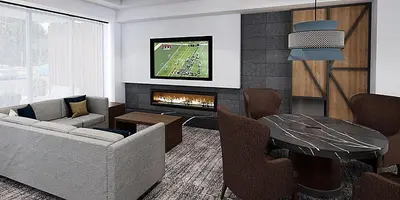 a living room with a couch and a fireplace at Staybridge Suites - Cincinnati East - Milford by IHG in Cincinnati