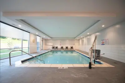 a large swimming pool in a building at Staybridge Suites - Cincinnati East - Milford by IHG in Cincinnati