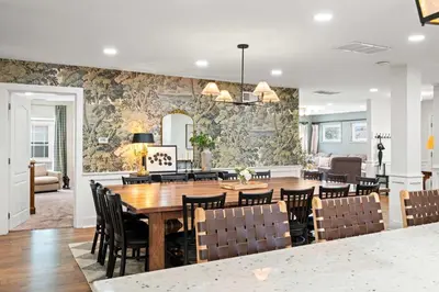 a dining room with a table and chairs at Spacious Home Near Ark, Perfect for 12 Guests in Williamstown