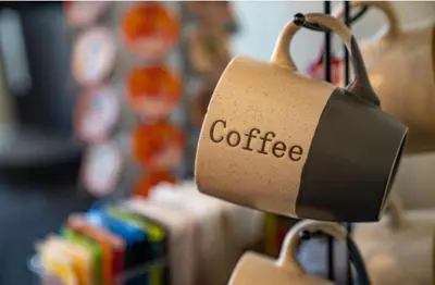 a coffee cup hanging from a storeacistacistsenalsenalsenalsenalsenalsenalsenal at The Victorian Guesthouse Bed & Breakfast in Delphos