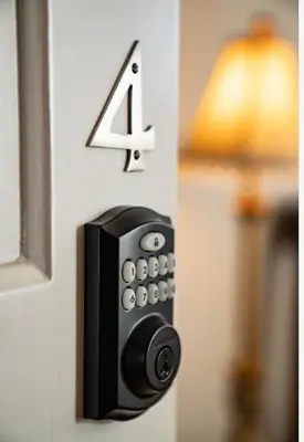 a door lock with the number four on it at The Victorian Guesthouse Bed & Breakfast in Delphos