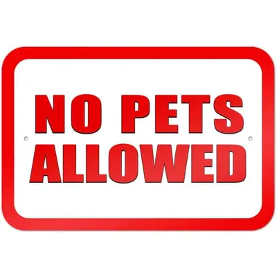 a sign with the words no pets allowed at The Victorian Guesthouse Bed & Breakfast in Delphos