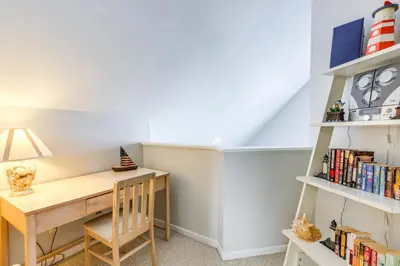 a home office with a desk and bookshelves at Family-Friendly Port Clinton Home with Private Deck in Port Clinton