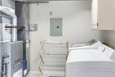 a laundry room with a washer and dryer at Family-Friendly Port Clinton Home with Private Deck in Port Clinton