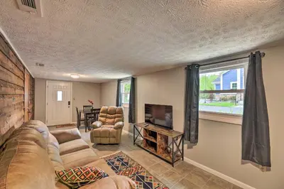 a living room with a couch and a tv at Lynn Dog-Friendly Abode with Mountain Views! in Hagerhill