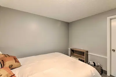 a bedroom with a white bed and a piano at Lynn Dog-Friendly Abode with Mountain Views! in Hagerhill