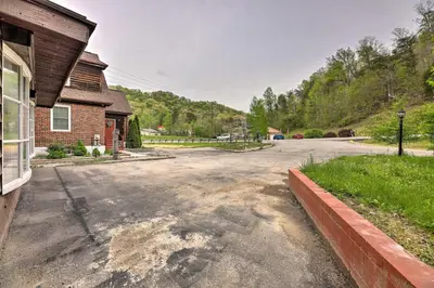 an empty street in front of a house at Lynn Dog-Friendly Abode with Mountain Views! in Hagerhill
