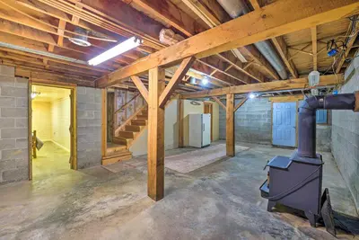 an empty room with a stove in a building at Rustic Zanesville Getaway with Expansive Yard! in Zanesville