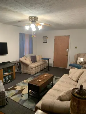 a living room with a couch and a table at Cherry717 in Fairborn