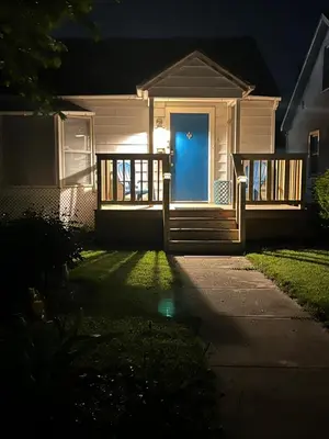 a house with a blue front door at night at Cherry717 in Fairborn
