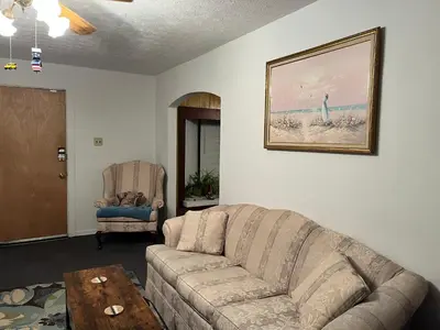 a living room with a couch and a chair at Cherry717 in Fairborn
