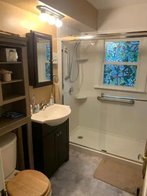 a bathroom with a shower and a sink and a toilet at Cherry717 in Fairborn