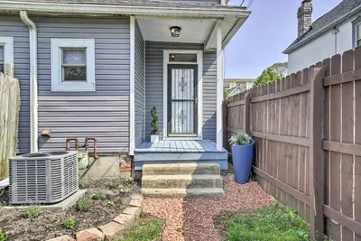 a house with a fence and a blue porch at Blue Yonder Half Mi to Childrens Hospital in Columbus