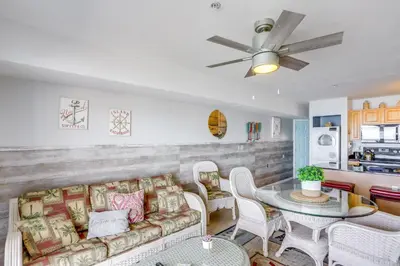 a living room with a couch and a table at Cozy Lakefront Middle Bass Retreat with Balcony in Put-in-Bay