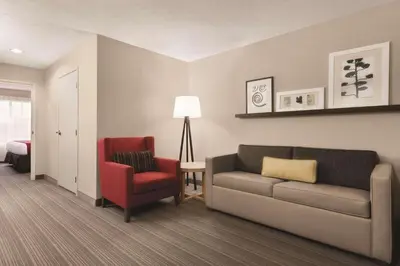 a living room with a couch and a chair at Country Inn & Suites by Radisson, Fairborn South, OH in Fairborn