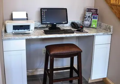 a desk with a computer on top of it at Country Inn & Suites by Radisson, Fairborn South, OH in Fairborn