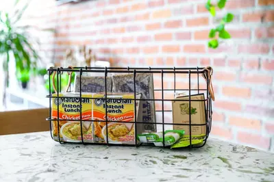 a basket filled with food sitting on a counter at Jungle House Luxury Homes - Columbus Downtown Short North - Walk to Convention Center & Nationwide Arena - Sleeps up to 10 - Free Parking - Over 5,800 Five Stars in Columbus