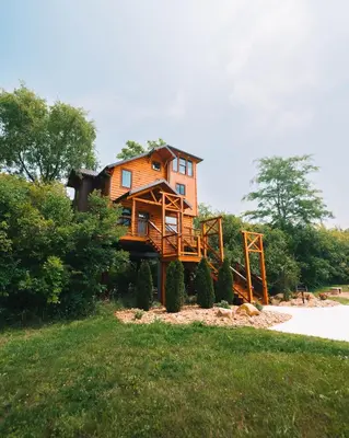 a house sitting on top of a hill at Skyview Treehouse by Amish Country Lodging in Millersburg