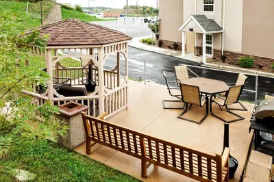a deck with a gazebo and a table and chairs at Microtel Inn & Suites by Wyndham St Clairsville - Wheeling in Saint Clairsville