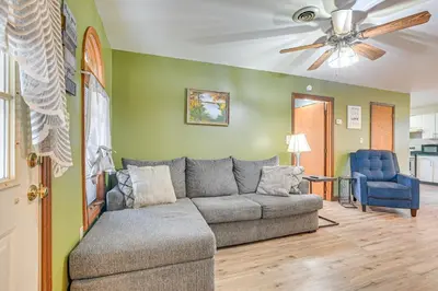 a living room with a couch and a ceiling fan at Quaint Zanesville Home with Game Room and Yard! in Zanesville