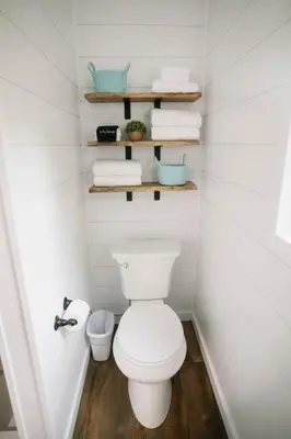 a bathroom with a white toilet and some towels at Cozy Cottage on 250 Acre Dairy Farm Near Ark in Dry Ridge